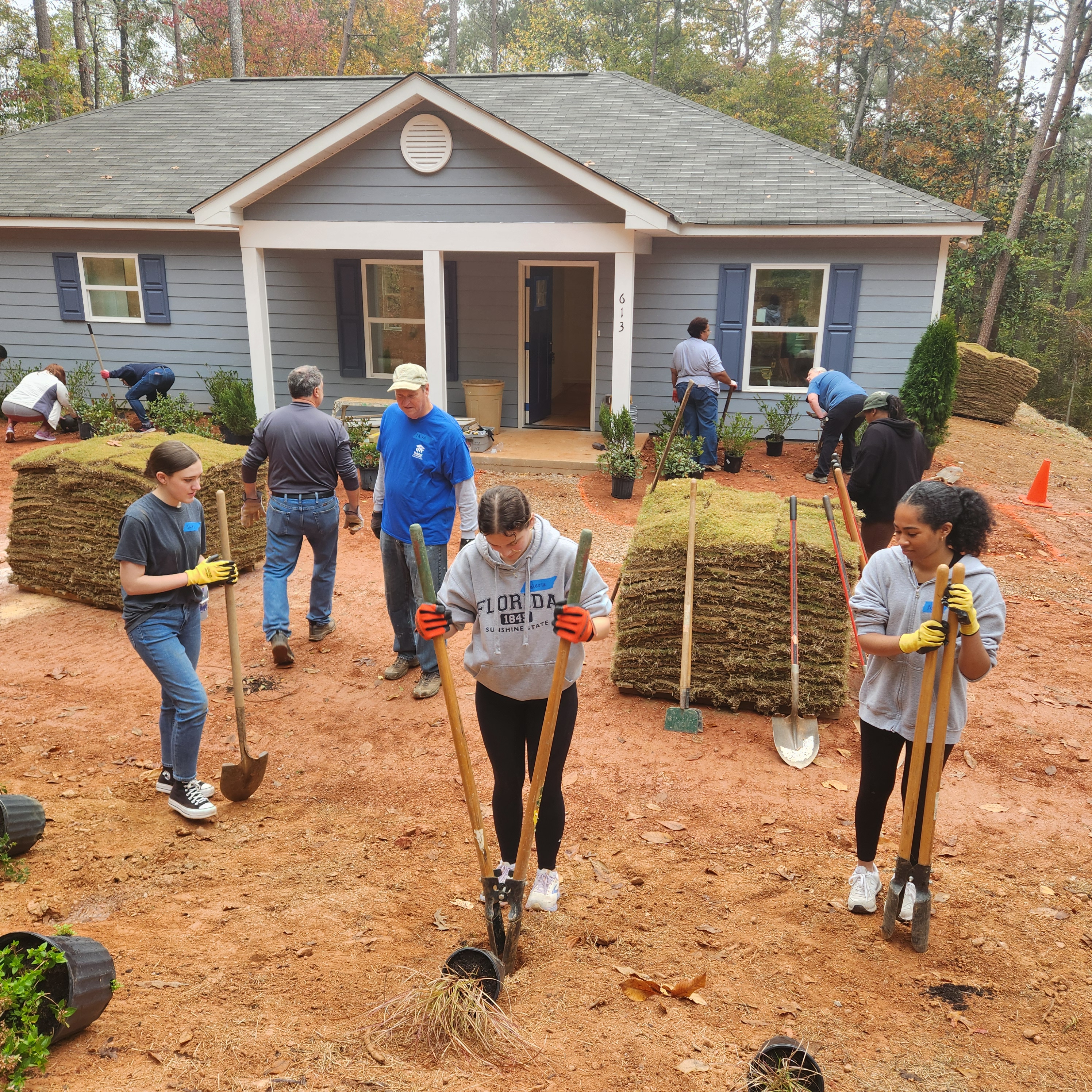 Habitat for Humanity volunteers repairing a home for a senior resident