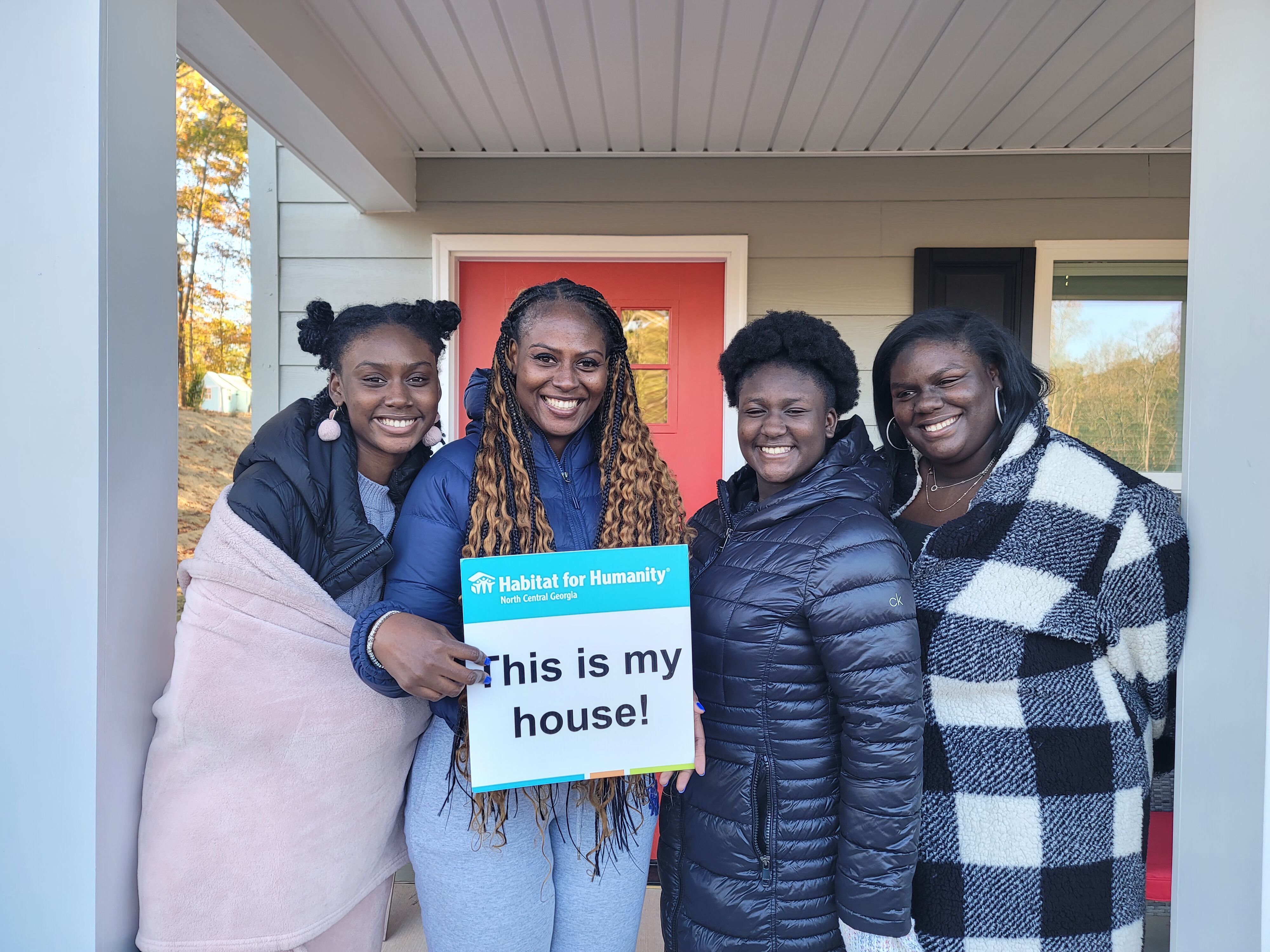 Family receiving keys to their new Habitat for Humanity home